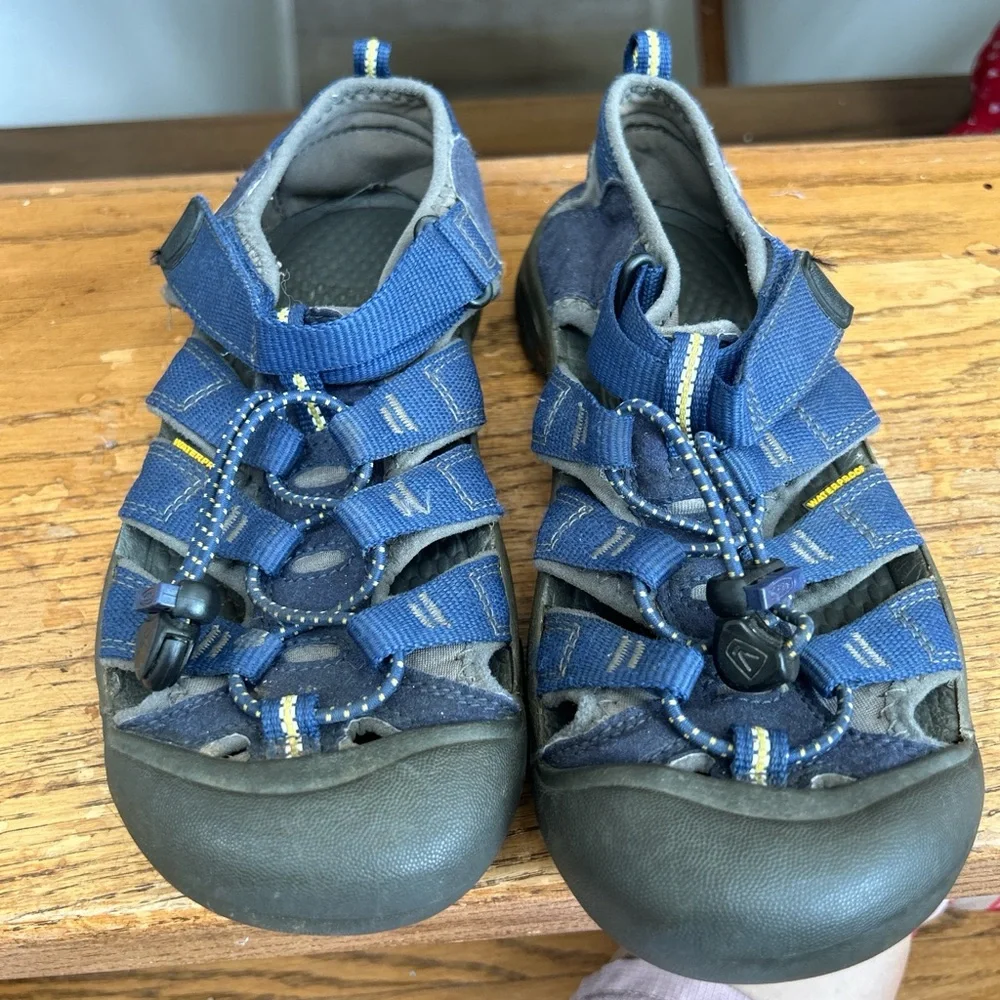 KEEN Kids' Newport H2 Sandals in a blue colorway hiking beach camp outdoors